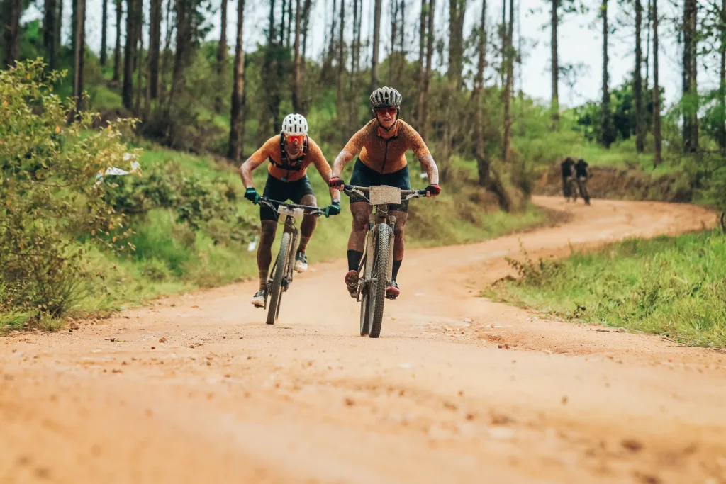 Maison Poulain team mountain biking on dirt road